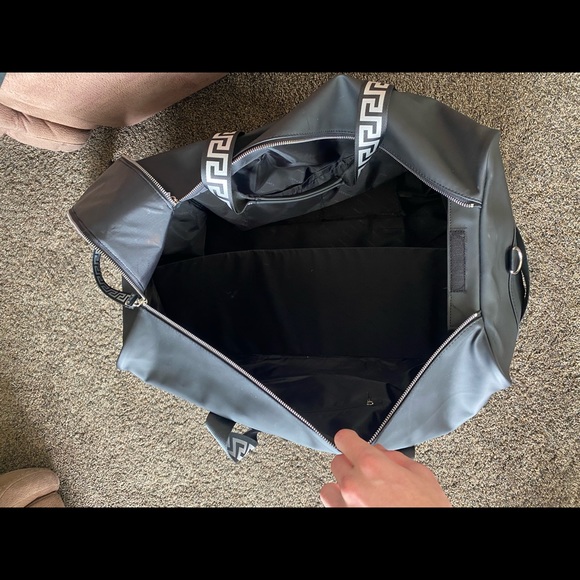 I am selling a Versace duffel bag. It is silver and black. - Picture 5 of 7